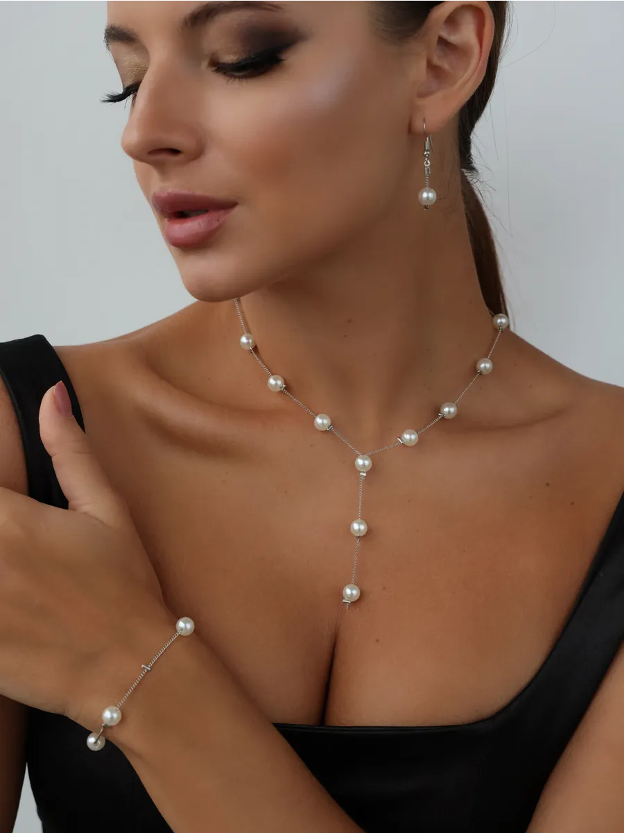 Комплект из жемчуга серьги колье и браслет